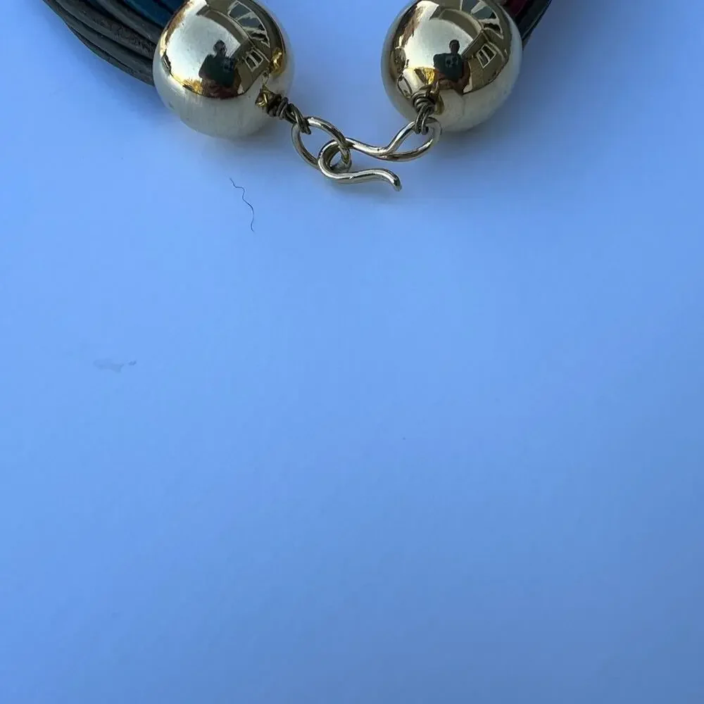 Necklace, multi strand, multi colored, gold leaf pendent. women's